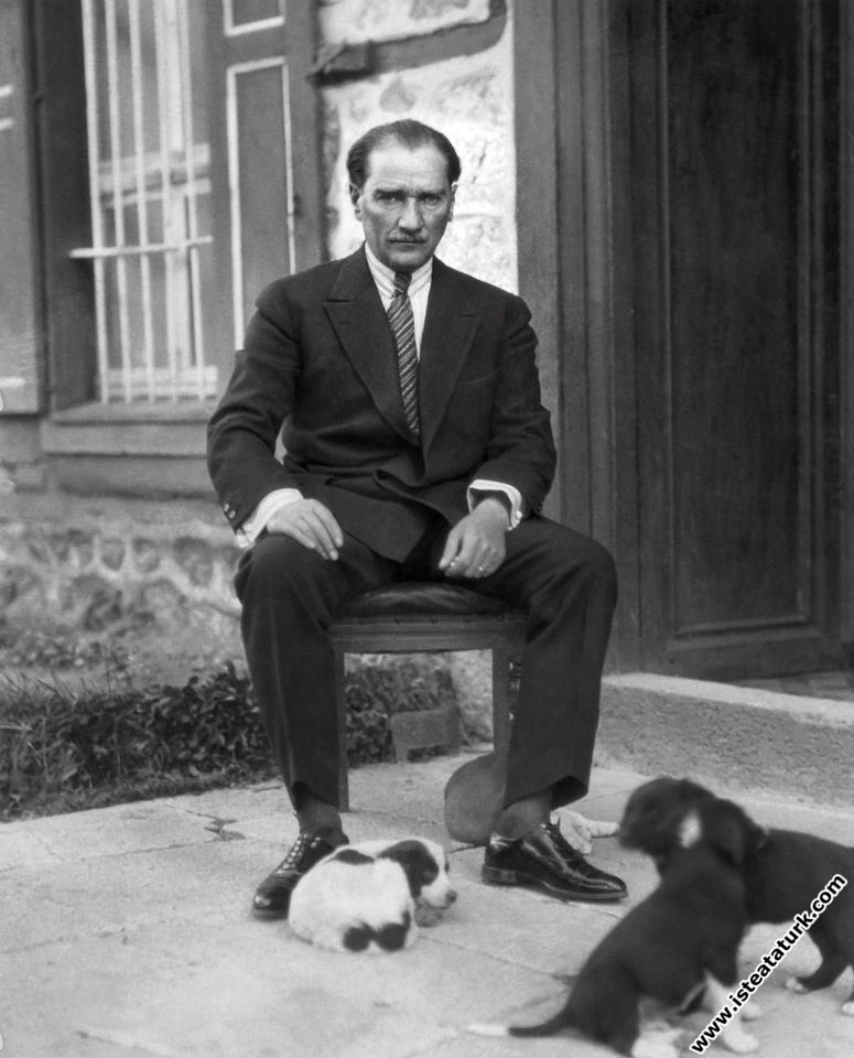 With puppies in the garden of Çankaya Mansion. (1923)