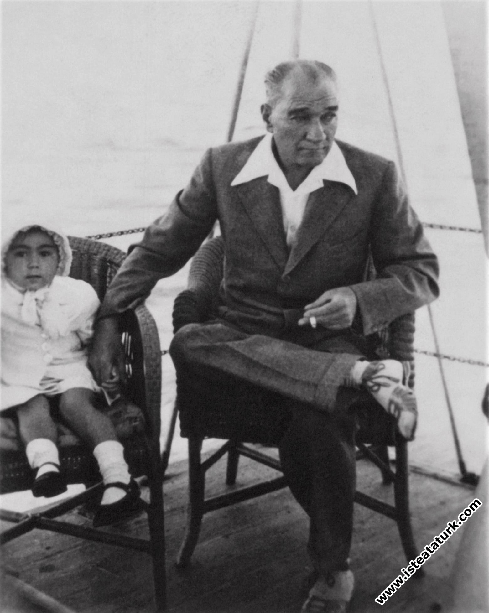 Atatürk with his adopted daughter Ülkü. (1936)